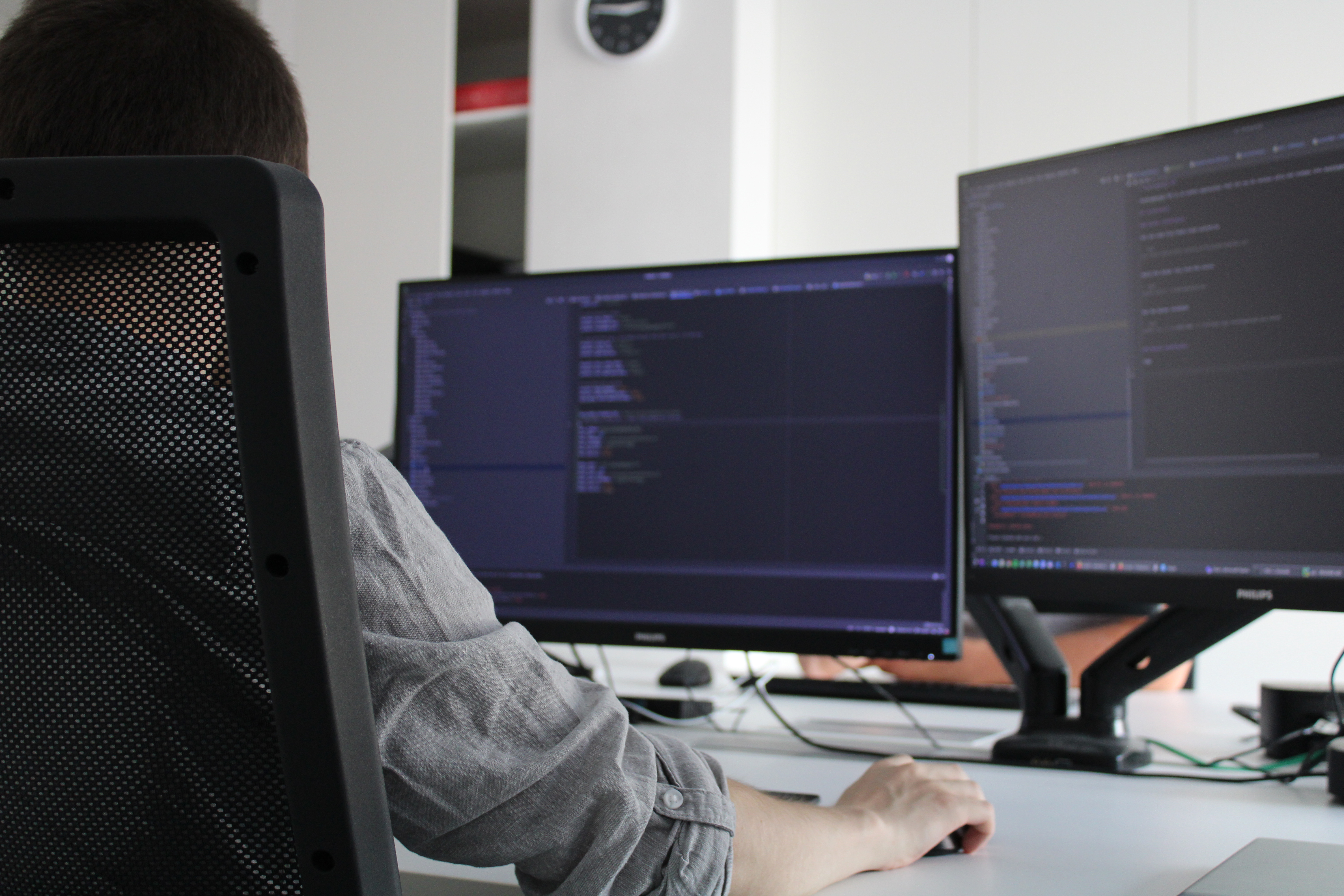 A closeup of a programmer in his personal habitat.